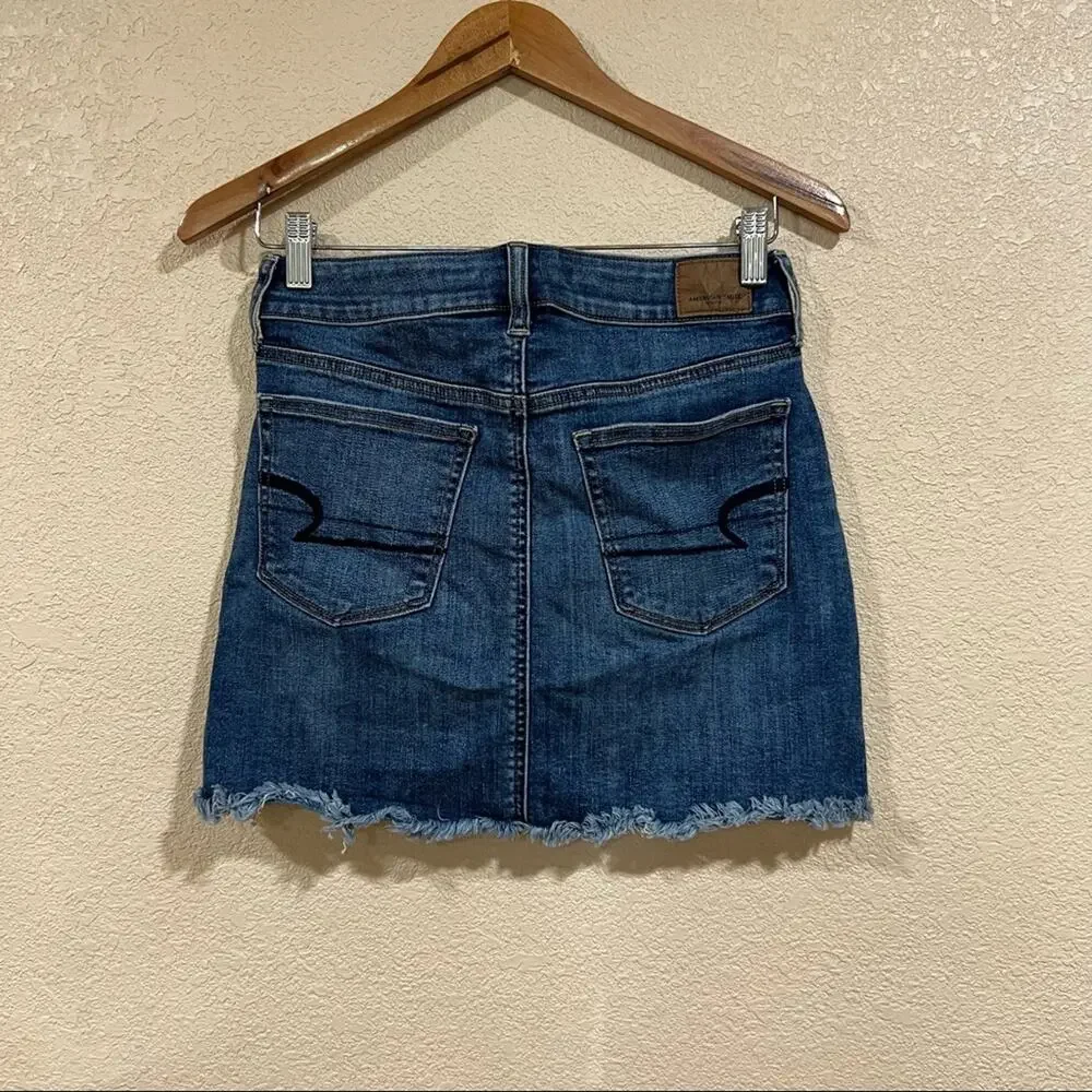 American Eagle Outfitters lightly distressed medium blue high rise mini skirt